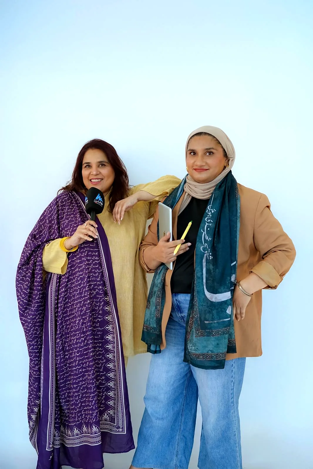 Shahmeen and Saba with a LiveFM microphone