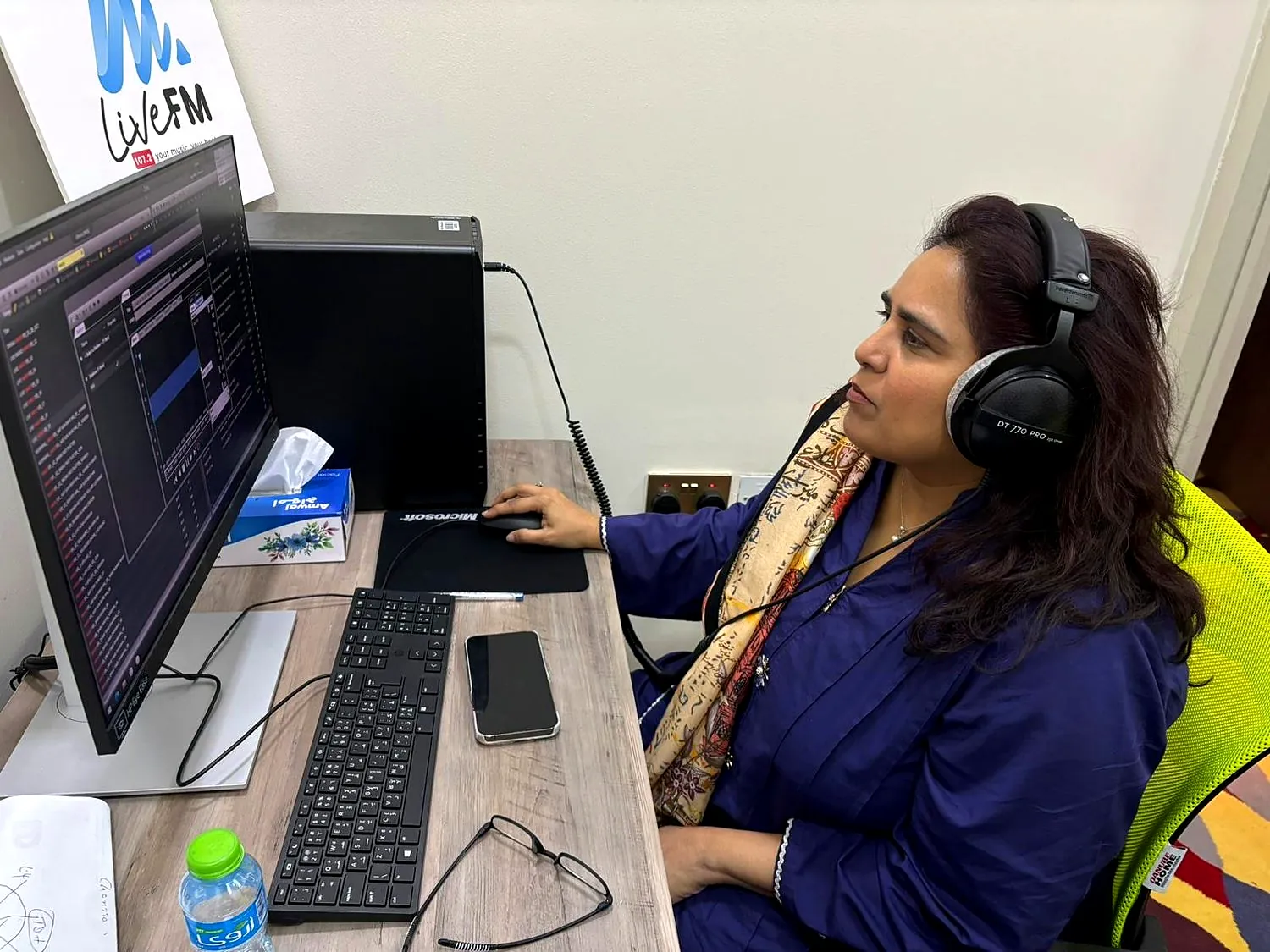 Shahmeen Islam at the LiveFM desk