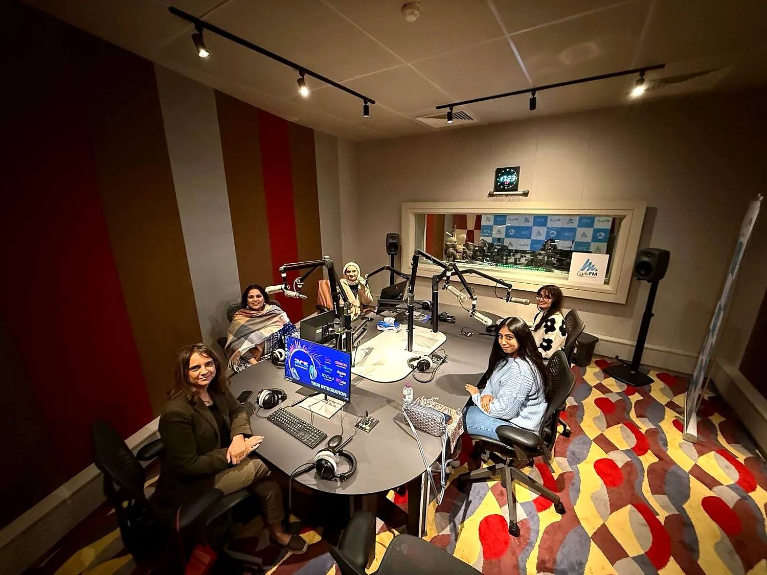 Guests around the table in the LiveFM studio
